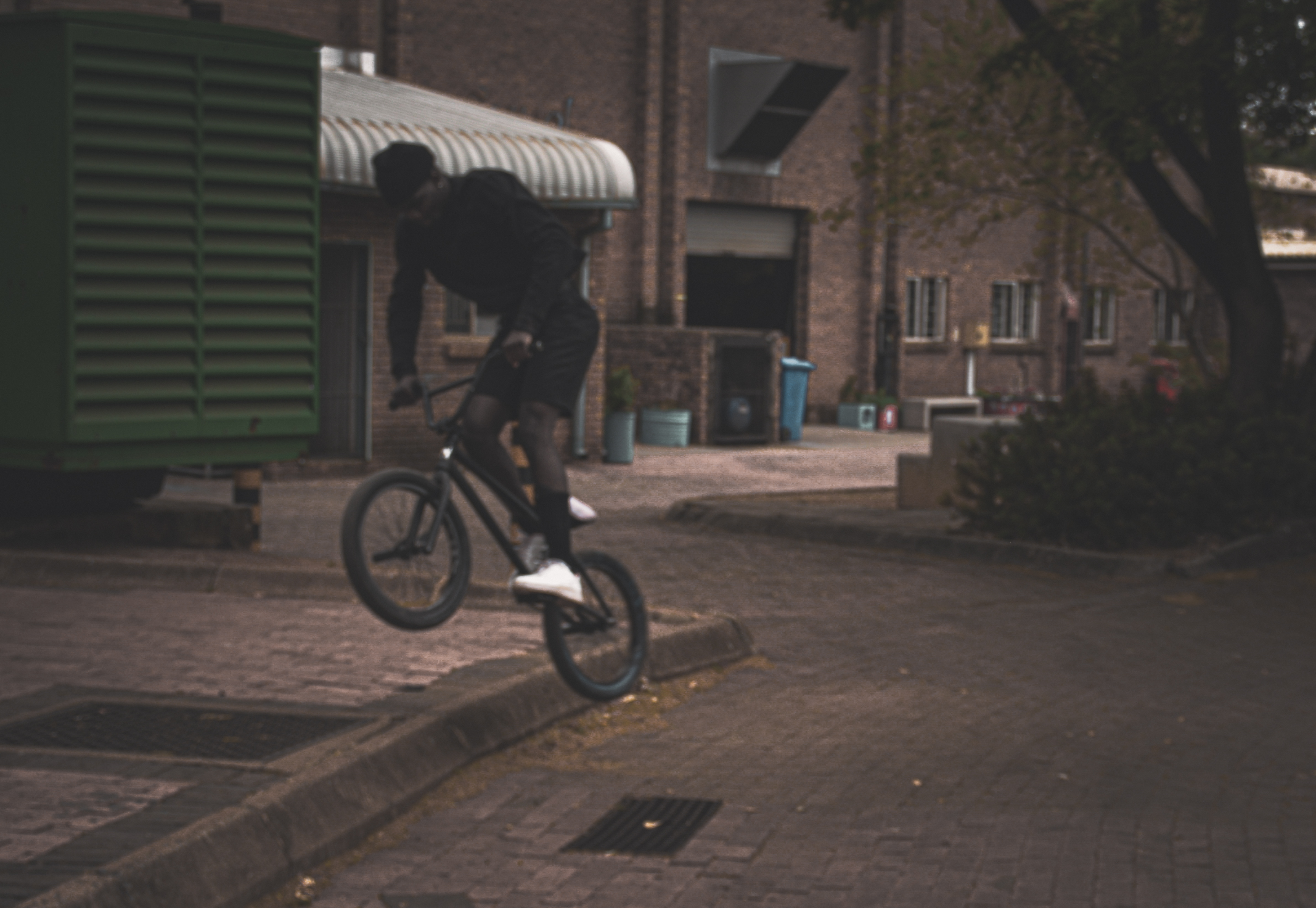 Documentary-style BMX campus photography with moody tones